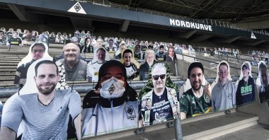 Portraits are set on the supporters tribune of Borussia Moenchengladbach, in Moenchengladbach, Germany, Thursday, April 16, 2020. (AP Photo) 