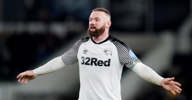 Wayne Rooney reacts during a match against Manchester United, in Derby, Britain, Thursday, March 5, 2020. (Reuters Photo)