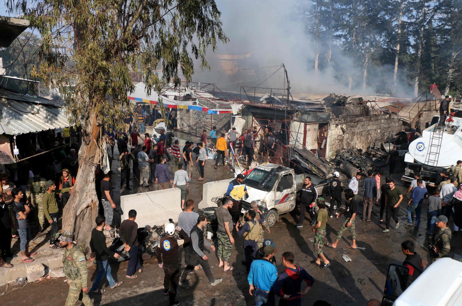 A handout picture released by Syrian Civil Defence rescue workers, also known as White Helmets, shows the scene of a fuel truck bomb that killed at least 40 civilians in the northern Syrian city of Afrin. April 28, 2020. (AFP Photo)