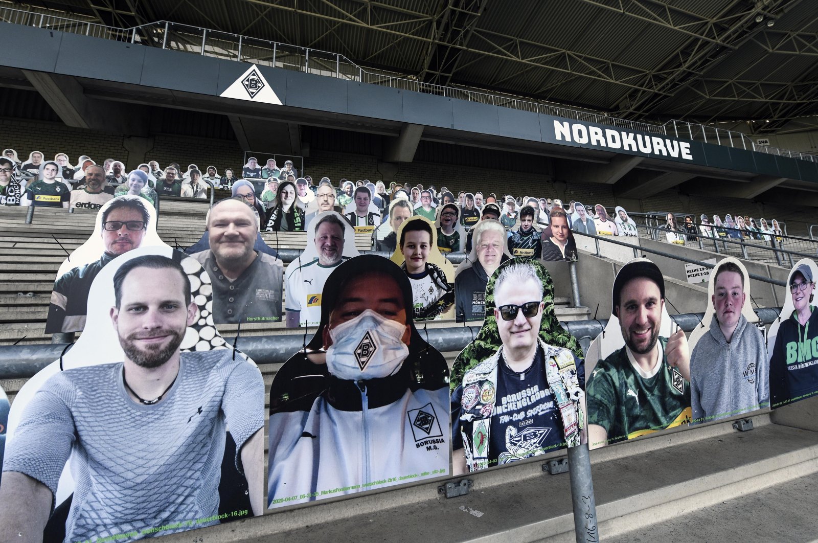 Portraits are set on the supporters tribune of Borussia Moenchengladbach, in Moenchengladbach, Germany, Thursday, April 16, 2020. (AP Photo) 