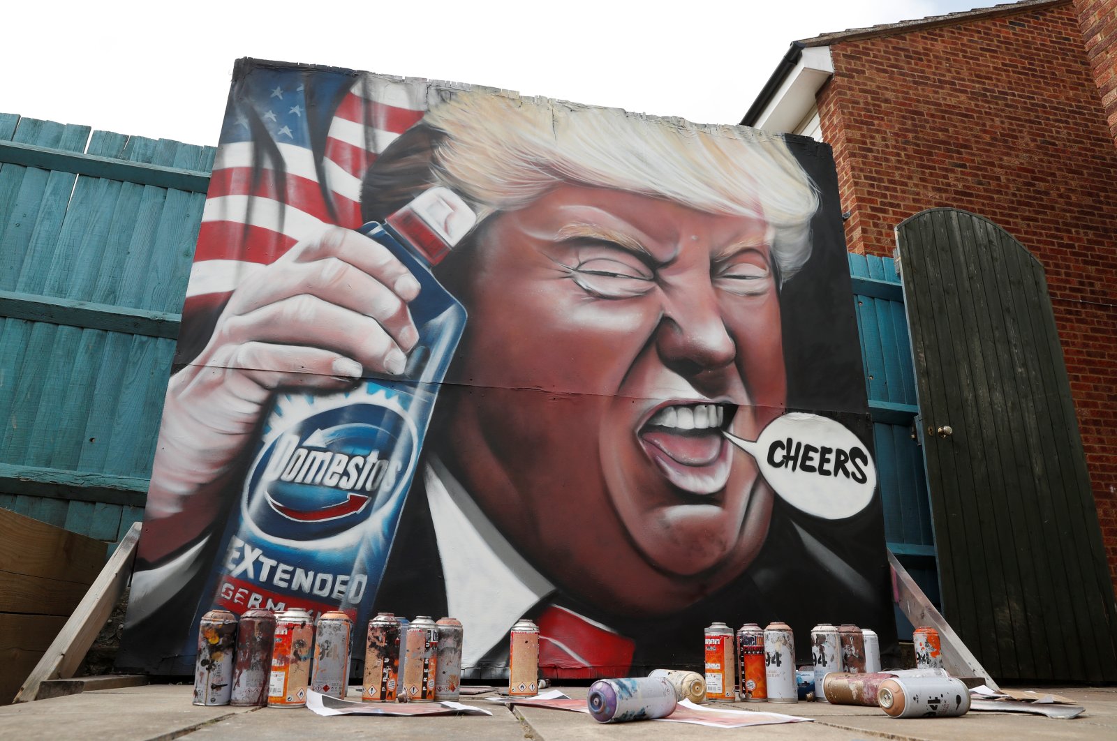 A mural of U.S. President Donald Trump holding a bottle of Domestos is seen in the garden of Dave Nash of Gnasher Murals following the coronavirus outbreak, Royston, Britain, April 27, 2020. (Reuters Photo)