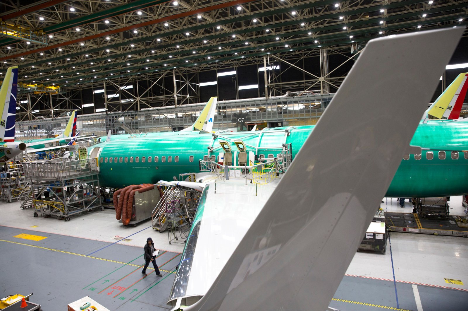 Employees work on Boeing 737 MAX airplanes at the Boeing Renton Factory in Renton, Washington, March 27, 2019. (AFP Photo)