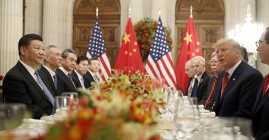 U.S. President Donald Trump (R) speaks as China's President Xi Jinping (L) listens during their bilateral meeting at the G-20 Summit in Buenos Aires, Argentina, Dec. 1, 2018. (AP Photo)