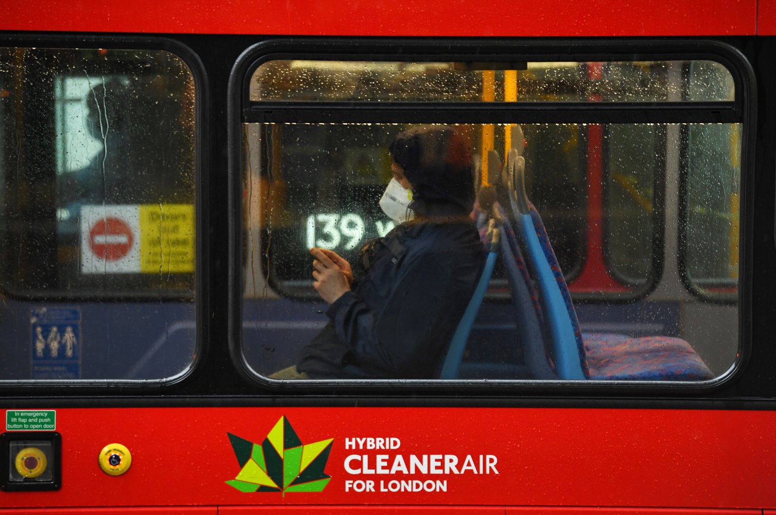 A person is seen wearing a mask on a bus on Oxford Street, as the COVID-19 outbreak continues, London, Britain, April 28, 2020. (Reuters Photo)