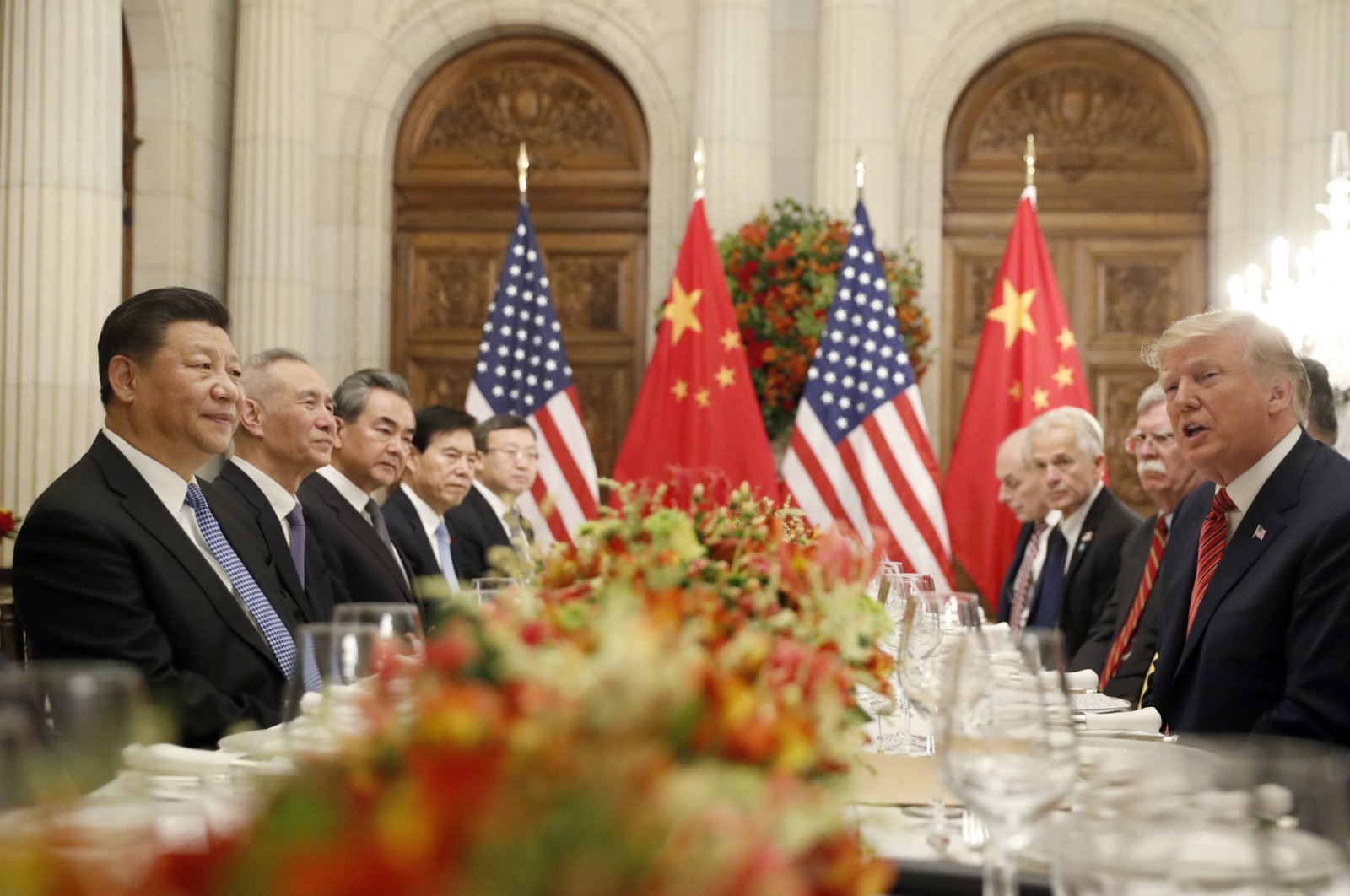 U.S. President Donald Trump (R) speaks as China's President Xi Jinping (L) listens during their bilateral meeting at the G-20 Summit in Buenos Aires, Argentina, Dec. 1, 2018. (AP Photo)