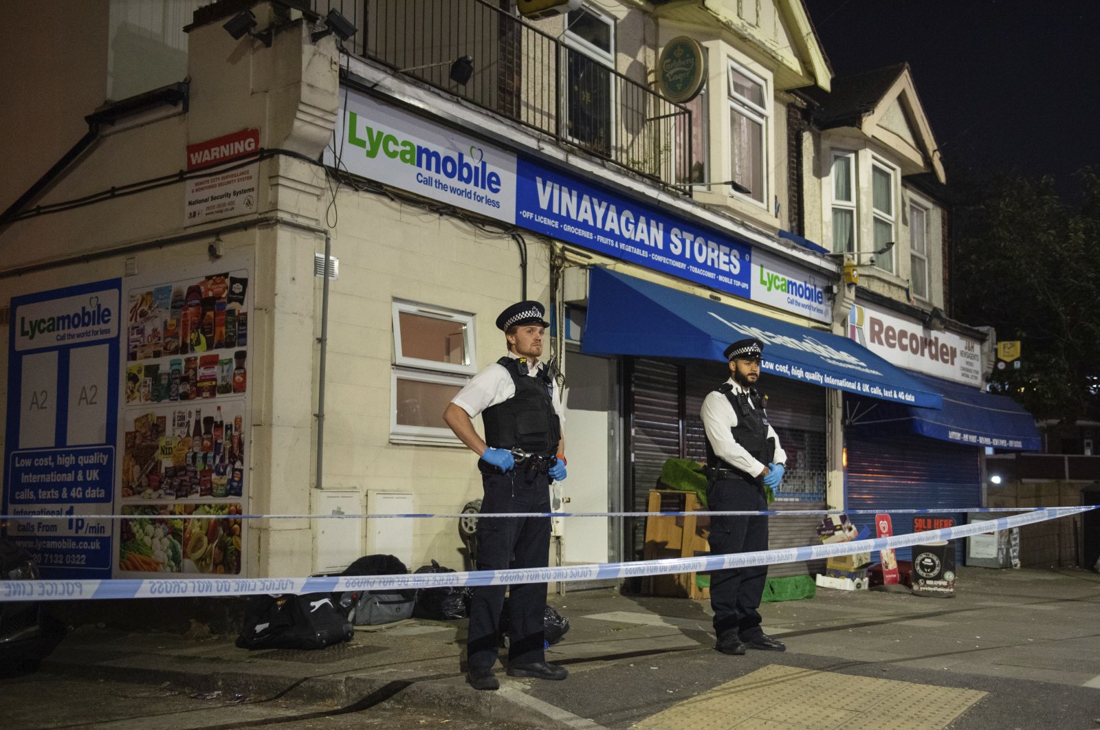 Police attend a crime scene in Ilford, east London, April 26, 2020. (AP Photo)