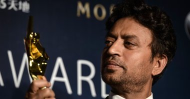 In this file photo from March 27, 2014, Best Actor winner Irrfan Khan poses with his trophy during the Asian Film Awards in Macau. (AFP Photo)