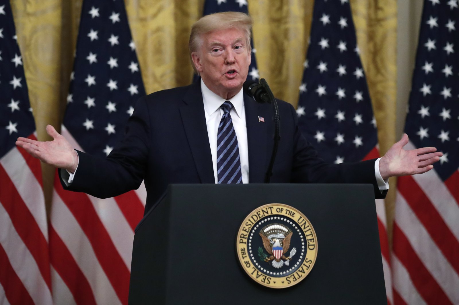 President Donald Trump answers questions from reporters during a event about protecting seniors, in the East Room of the White House, Thursday, April 30, 2020, in Washington. (AP Photo)