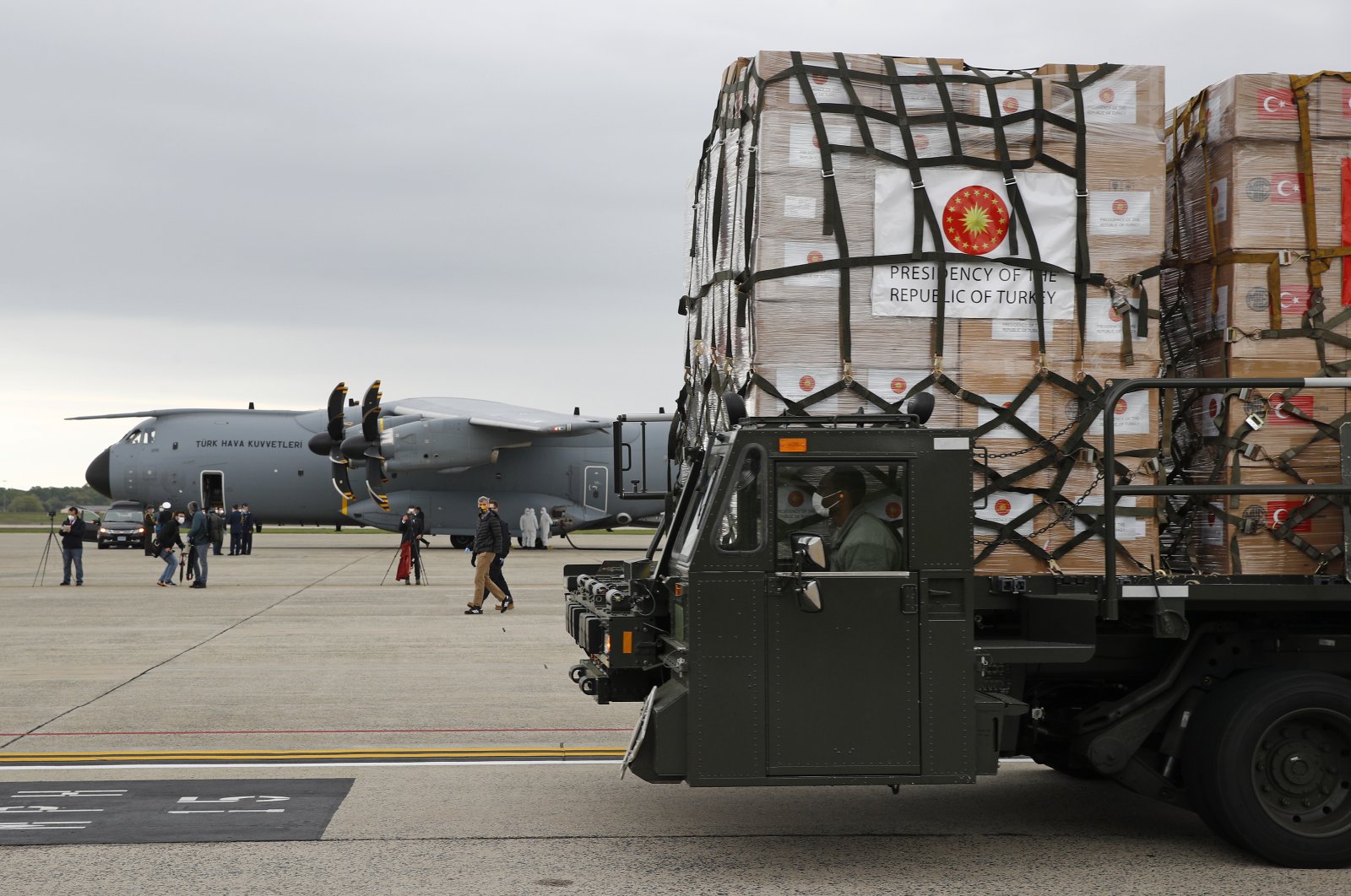 A U.S. Air Force vehicle carries a donation of medical supplies from Turkey after it was unloaded from a military plane, at Andrews Air Force Base, Maryland, April 28, 2020. (AP Photo)