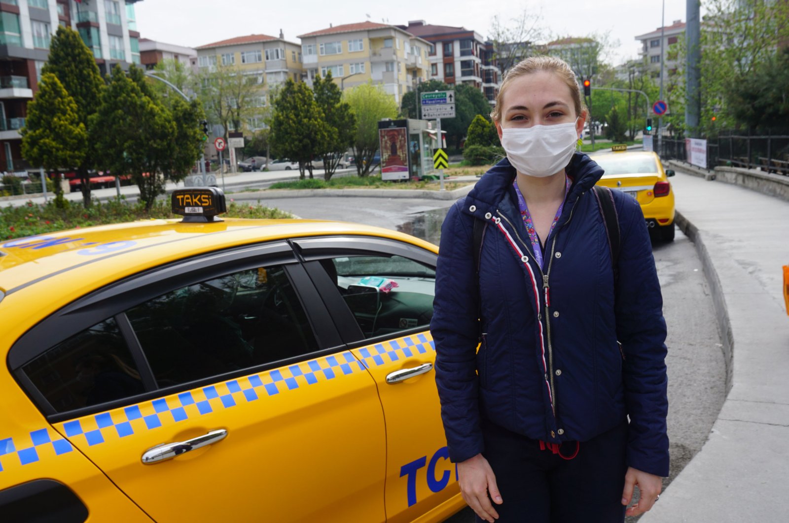 Naz Alibaşoğlu, a health worker that had finished her shift and benefitted from the taxi service, expresses her admiration of the practice, Istanbul, May 1, 2020. (DHA Photo)