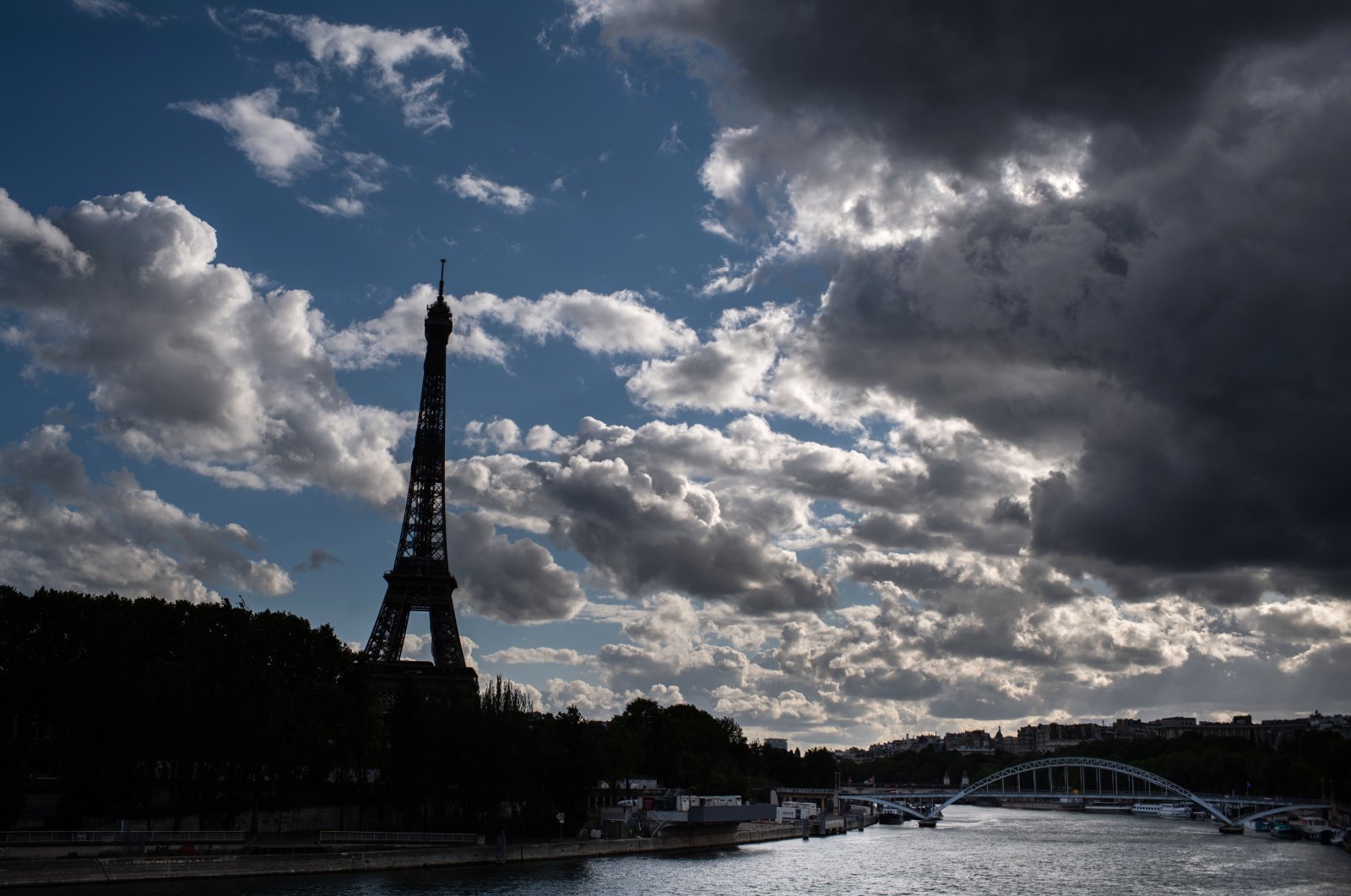 Seine river and the Eiffel Tower on a cloudy day on Labour Day (May Day) in Paris, on the 46th day of a lockdown aimed at curbing the spread of the COVID-19 pandemic, caused by the novel coronavirus on May 1, 2020. (AFP Photo)