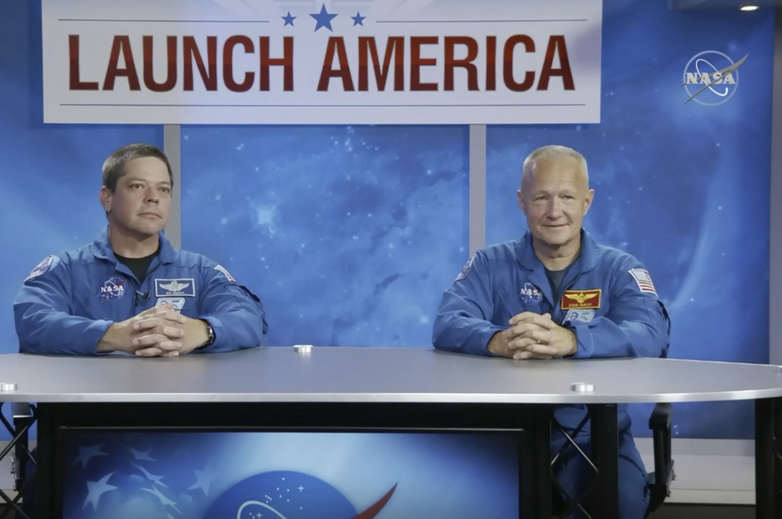 In this image from video made available by NASA, astronauts Bob Behnken, left, and Doug Hurley give a news conference at the Johnson Space Center in Houston on Friday, May 1, 2020. (AP Photo)