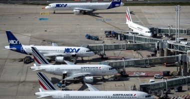 A picture taken on June 27, 2019 shows Air France and Joon (Air-France low cost company) Aibus and Boeing  parked  on the tarmac of Roissy-Charles de Gaulle Airport, north of Paris. (AFP Photo)