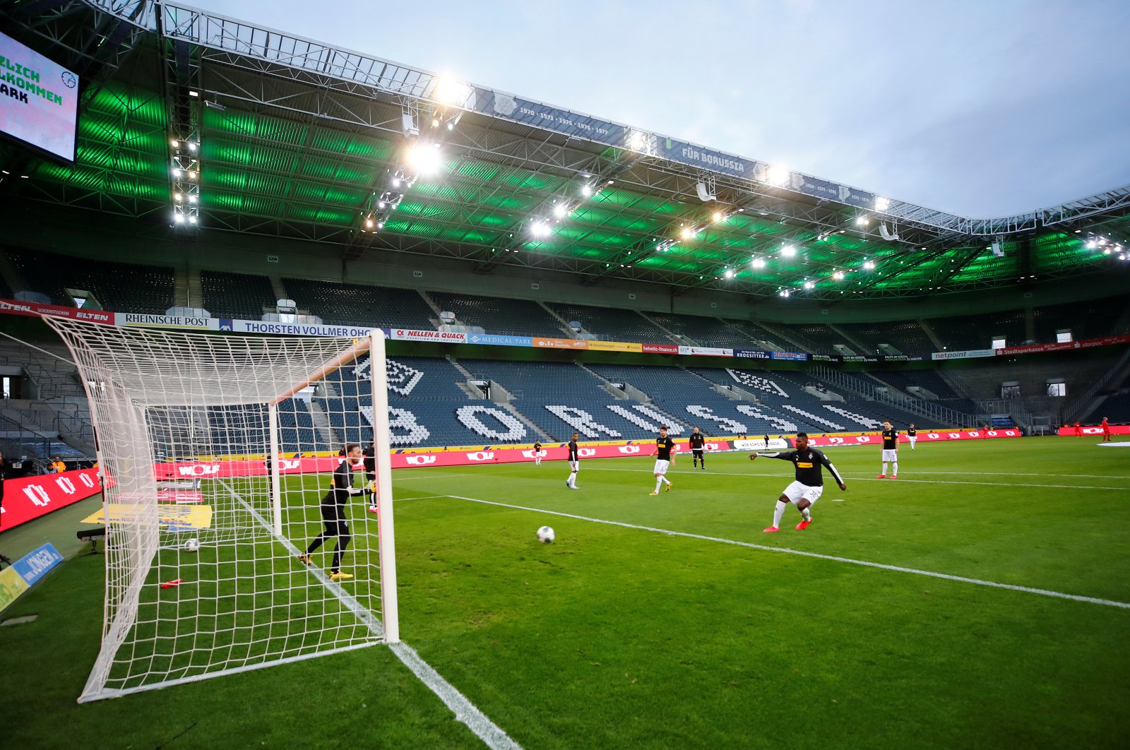 General view of Borussia players during the warm up before a match that was played behind closed doors on March 11, 2020 at Borussia-Park, Moenchengladbach, Germany. (Reuters Photo)