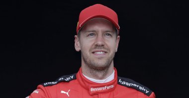 Ferrari's Sebastian Vettel poses for a photo at the Australian Grand Prix in Melbourne, March 12, 2020. (AP Photo)