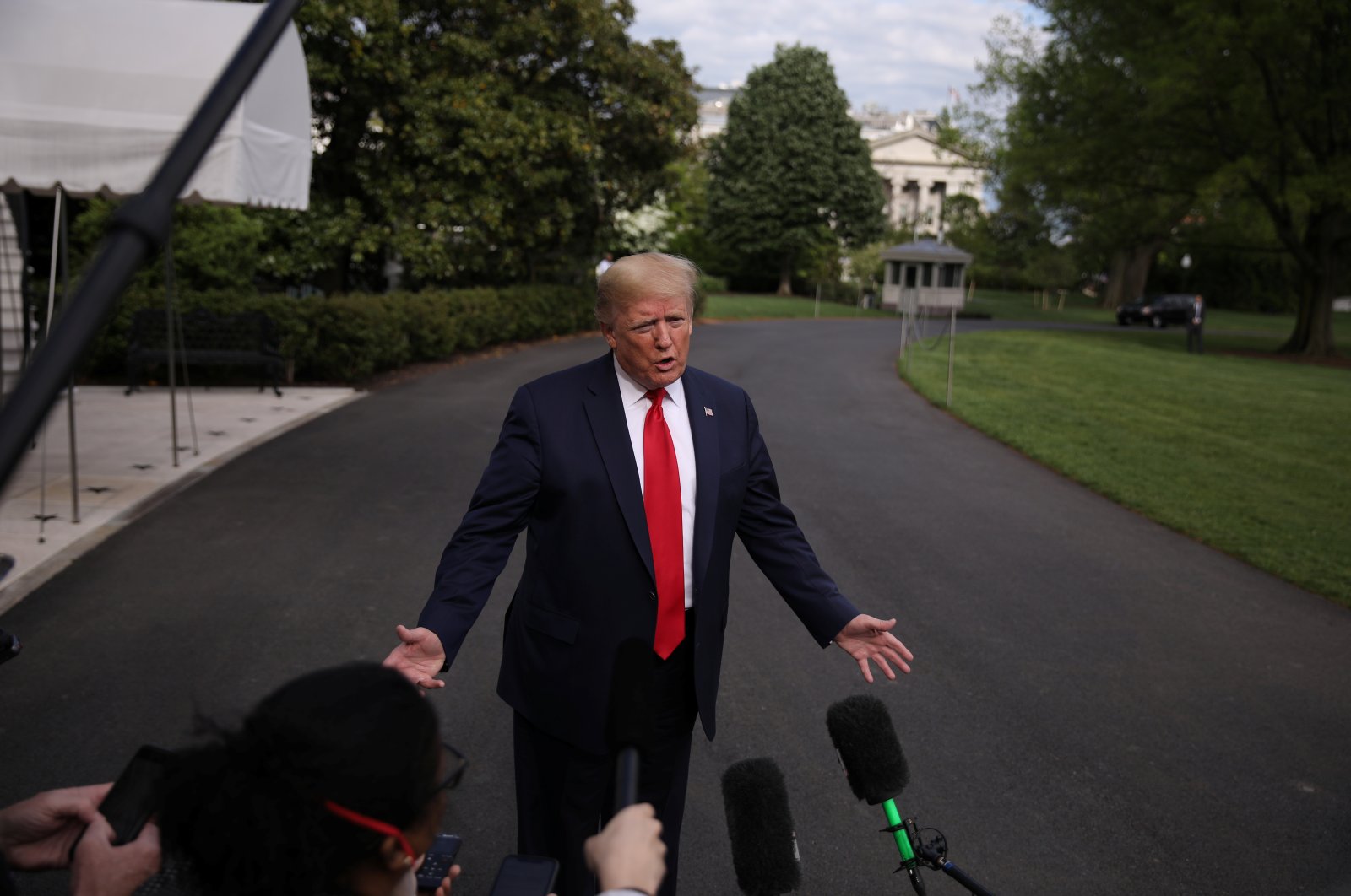 U.S. President Donald Trump talks to reporters on the South Lawn of the White House as he departs for the Camp David presidential retreat in Washington, U.S., May 1, 2020. (Reuters Photo)