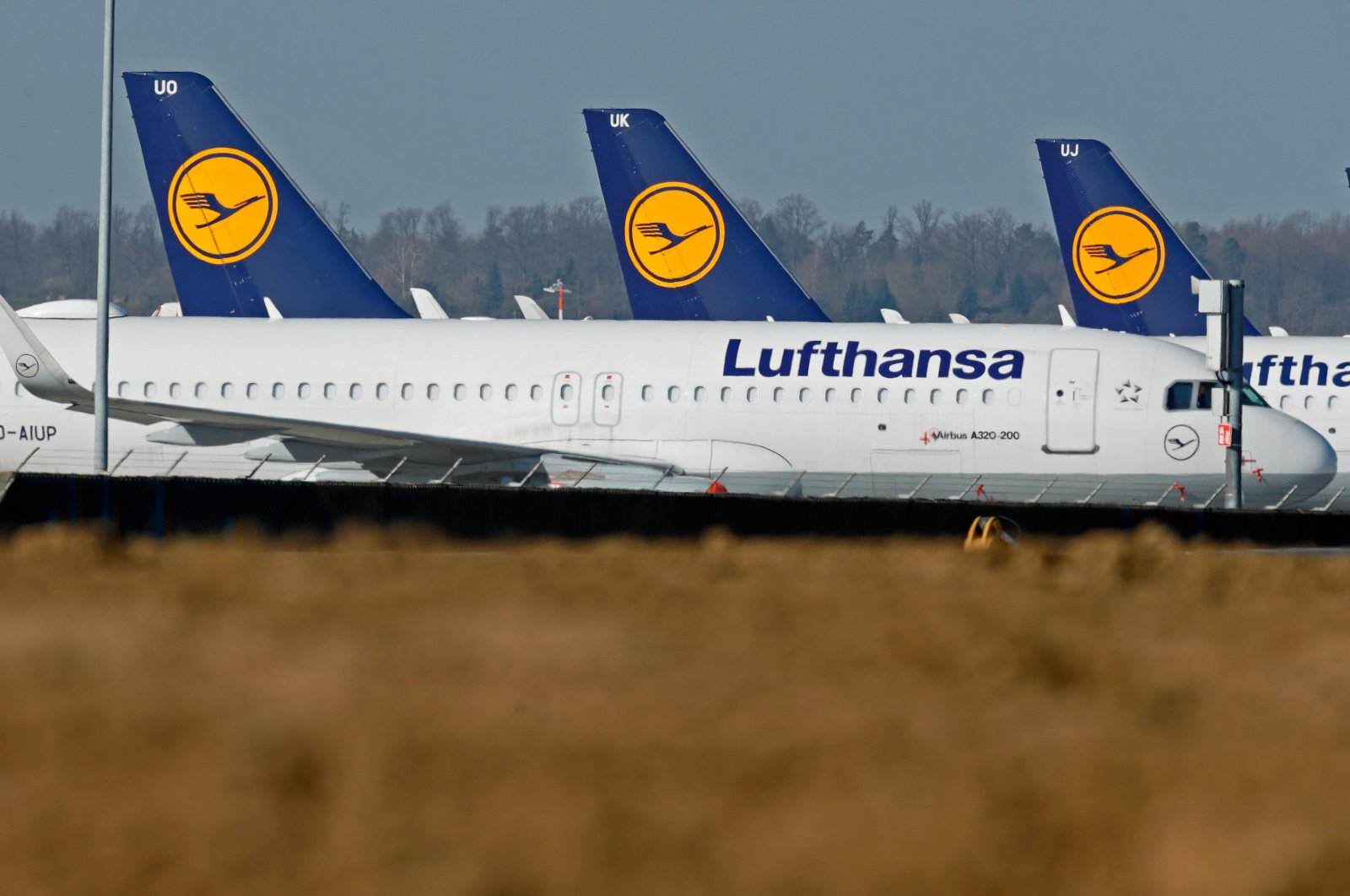 Aircrafts from German air carrier Lufthansa sit on blocks at the international airport in Stuttgart, Germany, April 6 2020. (EPA Photo)