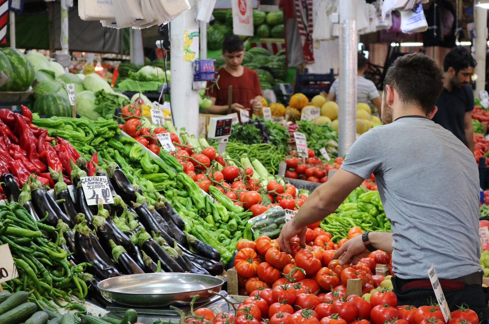 A seller arranges his produce at a bazaar in Turkey's Sivas, July 4, 2019. (Shutterstock Photo)