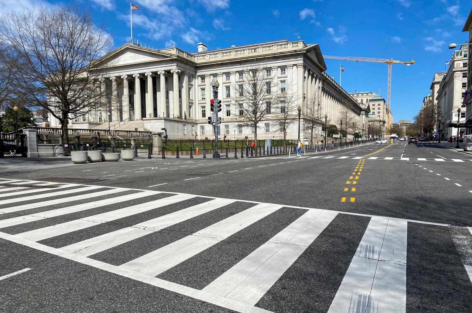 The U.S. Treasury Department building is seen next to an almost empty 15th Street at noon in Washington, March 13, 2020. (AFP Photo)