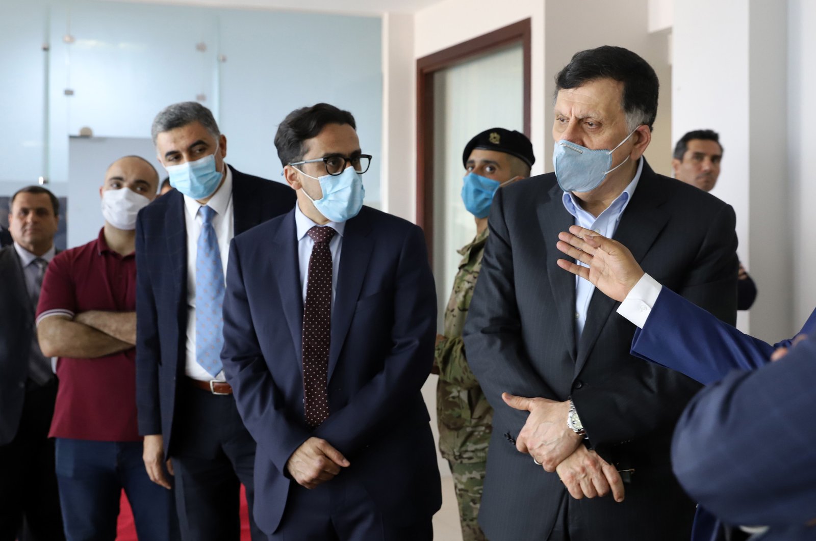 Fayez al-Sarraj (R), prime minister of Libya's U.N.-recognized Government of National Accord (GNA), visits a COVID-19 response center in the capital Tripoli, Libya, May 4, 2020. (AFP Photo )