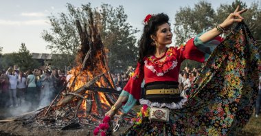 In this undated photo, a woman in traditional attire dances during the Kakava (Hıdırellez) celebrations in the border province of Edirne. (DHA Photo)
