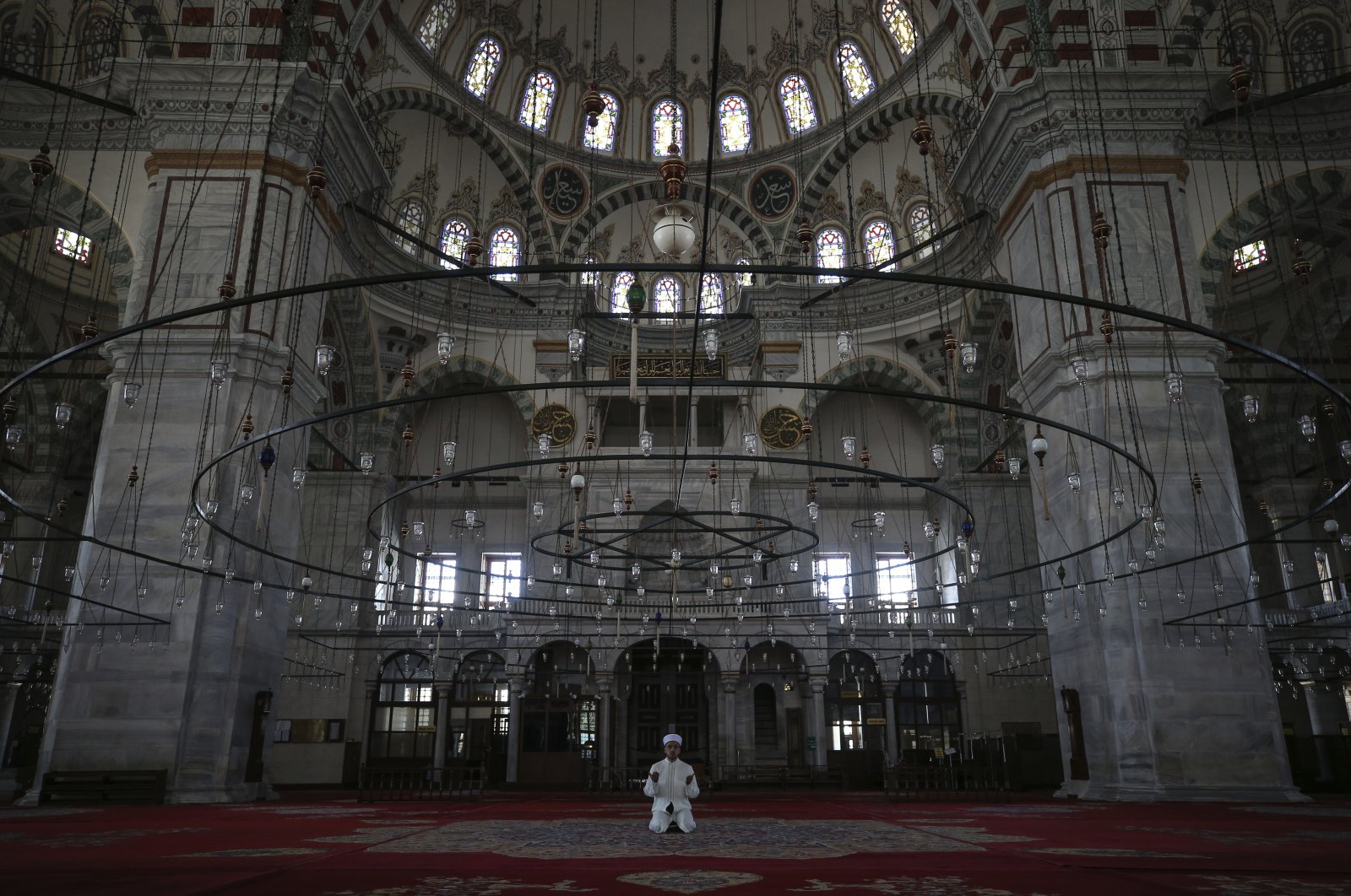 Esat Şahin, imam of the iconic Fatih Mosque, holds prayers on the first day of Ramadan without the public due to the coronavirus restrictions in Istanbul, Turkey, April 24, 2020. (AP Photo)