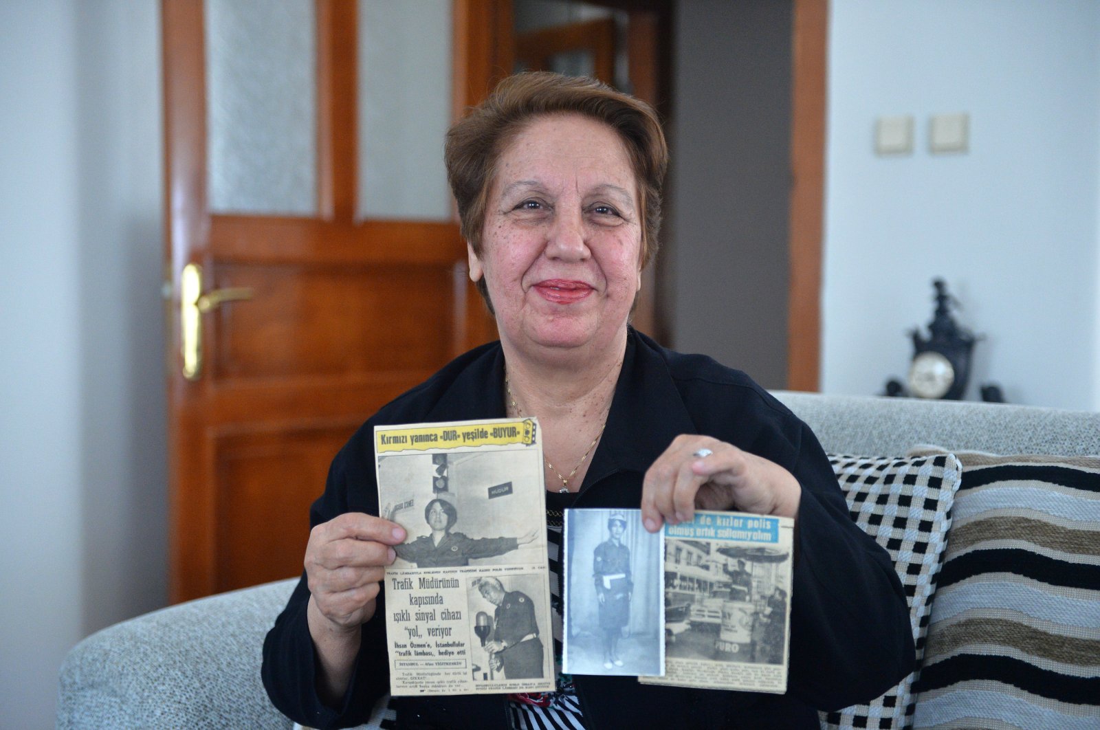 Fikriye Yavuz shows clippings with stories about her, in Mersin, Turkey, Wednesday, May 6, 2020. (AA Photo) 