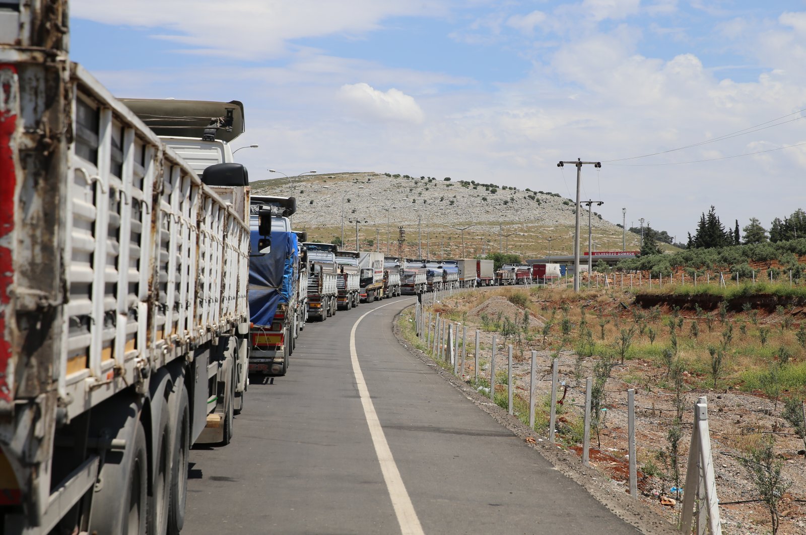The 52 trucks loaded with the supplies entered Syria through the Cilvegözü border gate in Turkey's southern Hatay province, which borders Idlib, May 6, 2020. (AA)