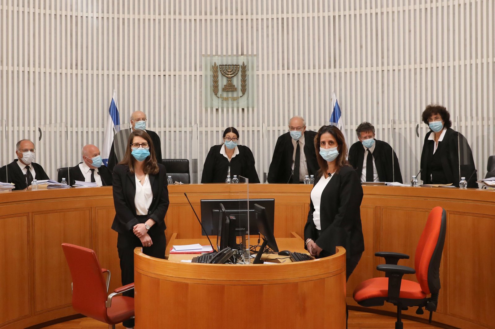 Judges and personnel of the Israeli Supreme Court wearing face masks against the coronavirus Covid-19, attend a session on May 4, 2020 at the Supreme Court in Jerusalem. (AFP Photo)