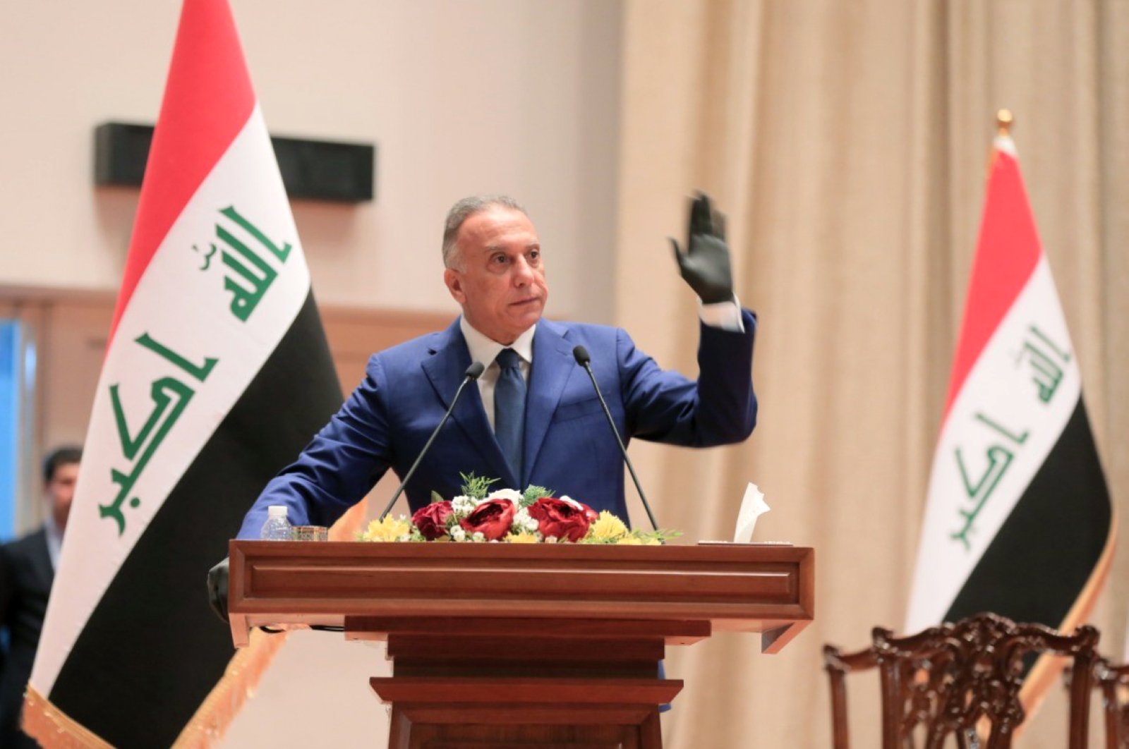 Iraqi Prime Minister Mustafa al-Kadhimi taking the oath in front of the parliament during an overnight session in Baghdad, May 7, 2020. (AFP)