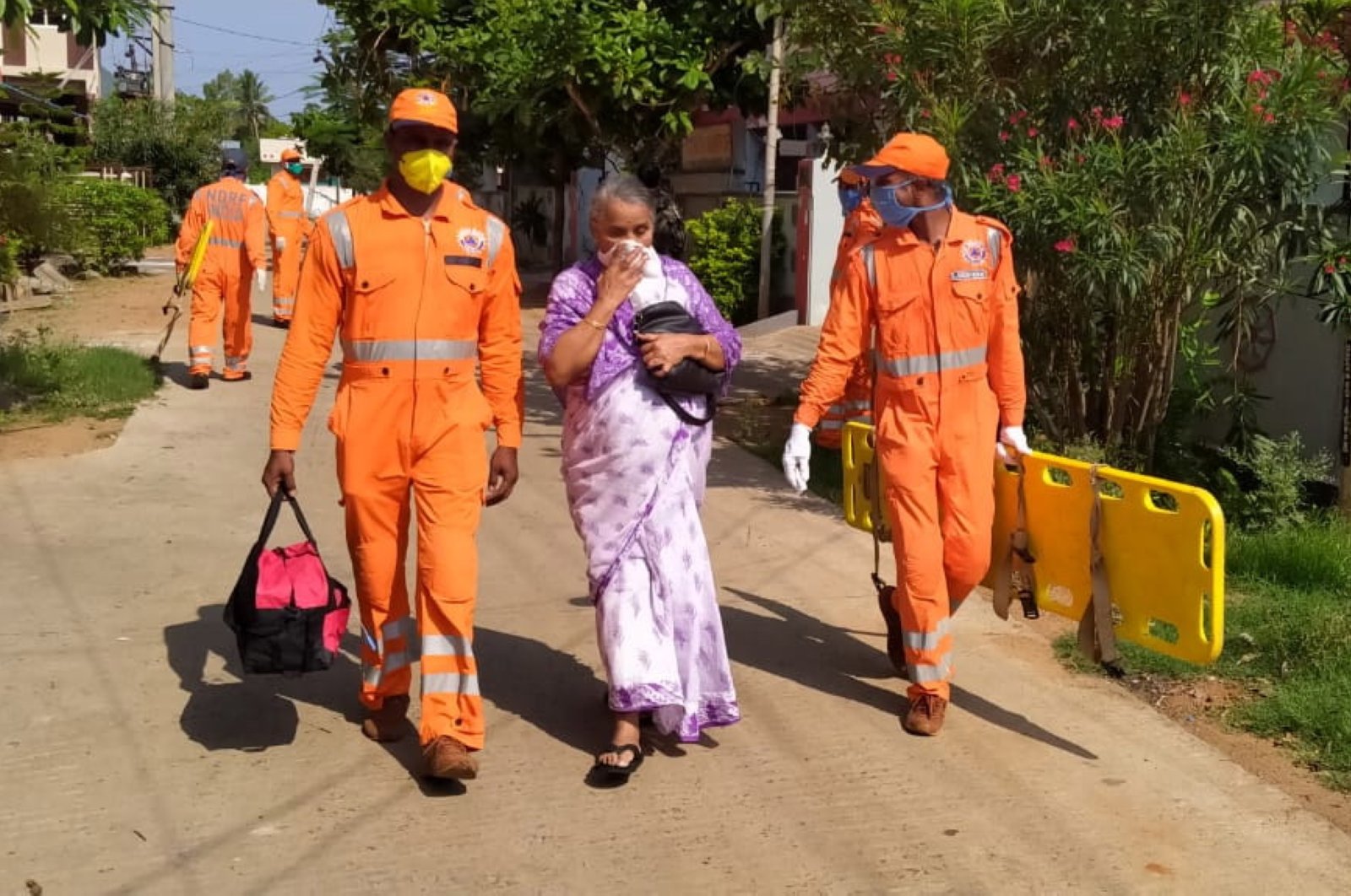 A handout photo made available by the National Disaster Response Force (NDRF) shows personnel during rescue operations after a gas leak at a chemical factory in Visakhapatnam, Andhra Pradesh state, southern India, May 7, 2020. (EPA Photo)