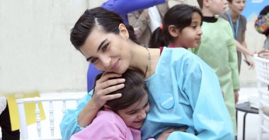 Famous Turkish actress Tuba Büyüküstün, who is also a UNICEF goodwill ambassador, in an organization for refugee children, in Turkey, 2018. (AA Photo) 