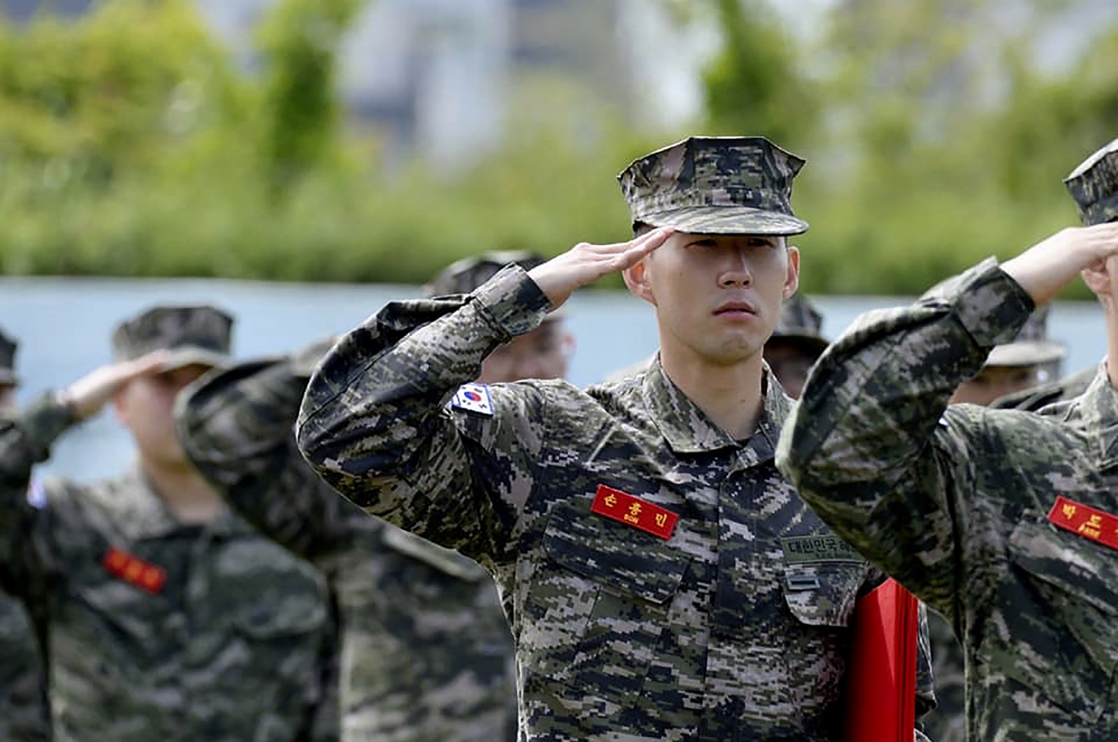 In this photo provided by South Korea Marine Corps' Facebook, Tottenham Hotspur forward Son Heung-min salutes during a basic military training completion ceremony at a Marine Corps boot camp in Seogwipo on Jeju Island, South Korea, Friday, May 8, 2020. (South Korea Marine Corps' Facebook via AP)