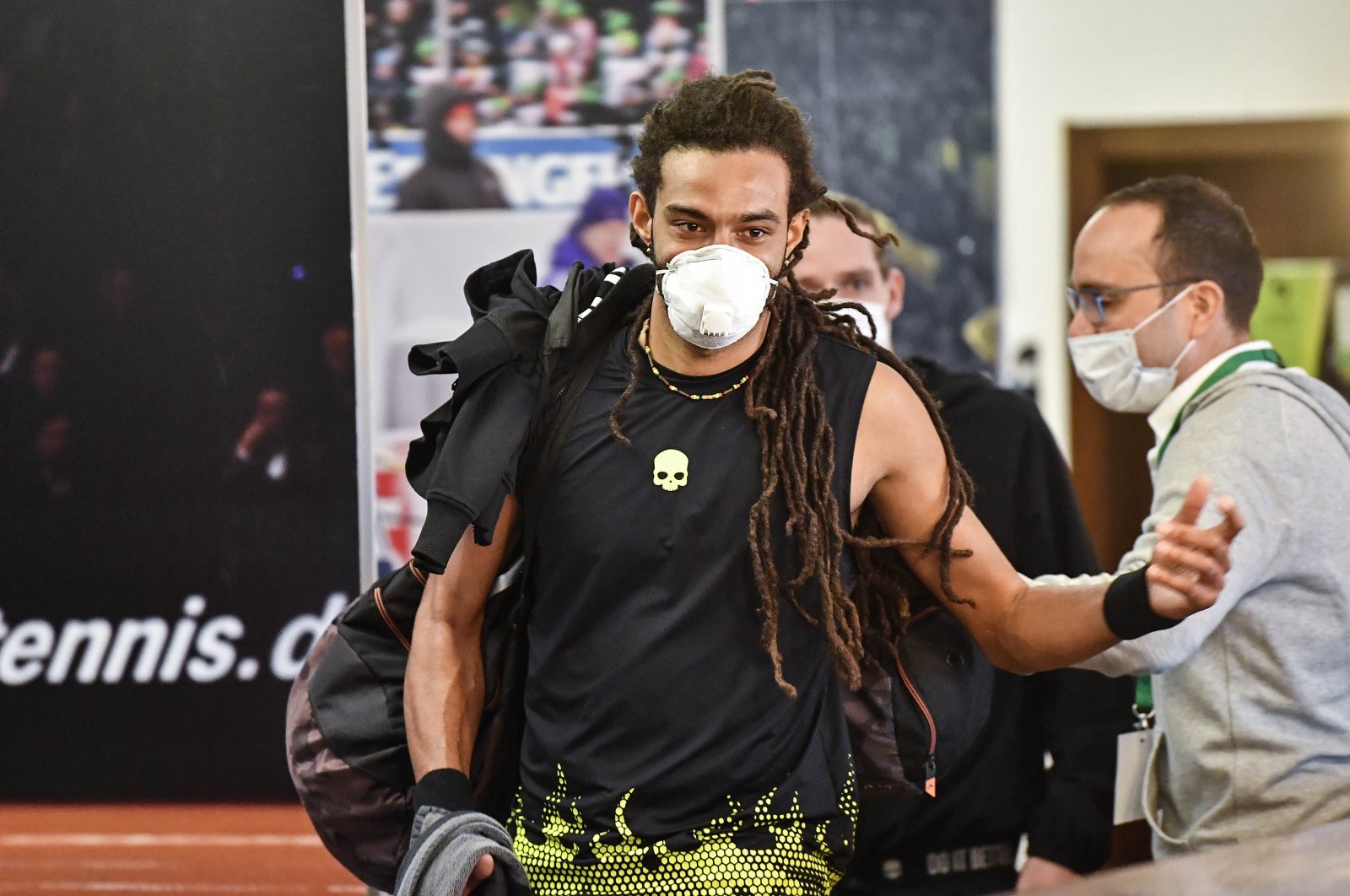 Tennis player Dustin Brown wears a face mask at a pro-tennis tournament in Hoehr-Grenzhausen, Germany, , May 1, 2020. (AP Photo)