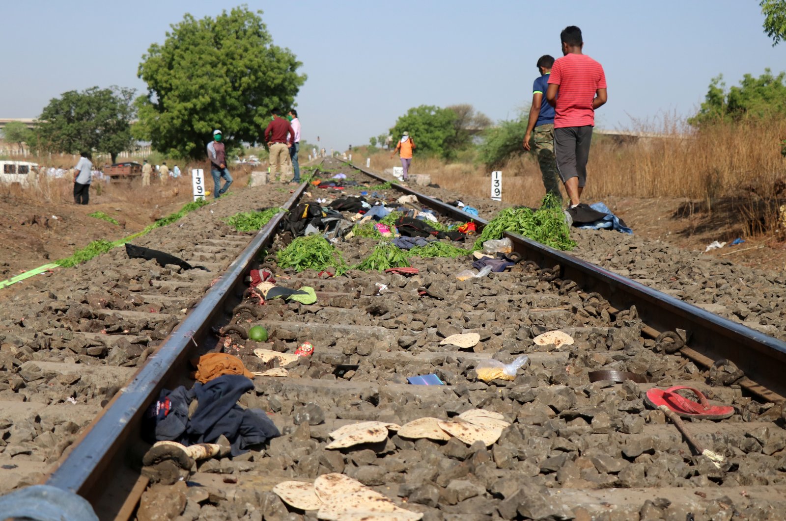 The belongings of victims lie scattered after a train ran over migrant workers sleeping on the track in the Aurangabad district of the western state of Maharashtra, India, May 8, 2020. (Reuters Photo)