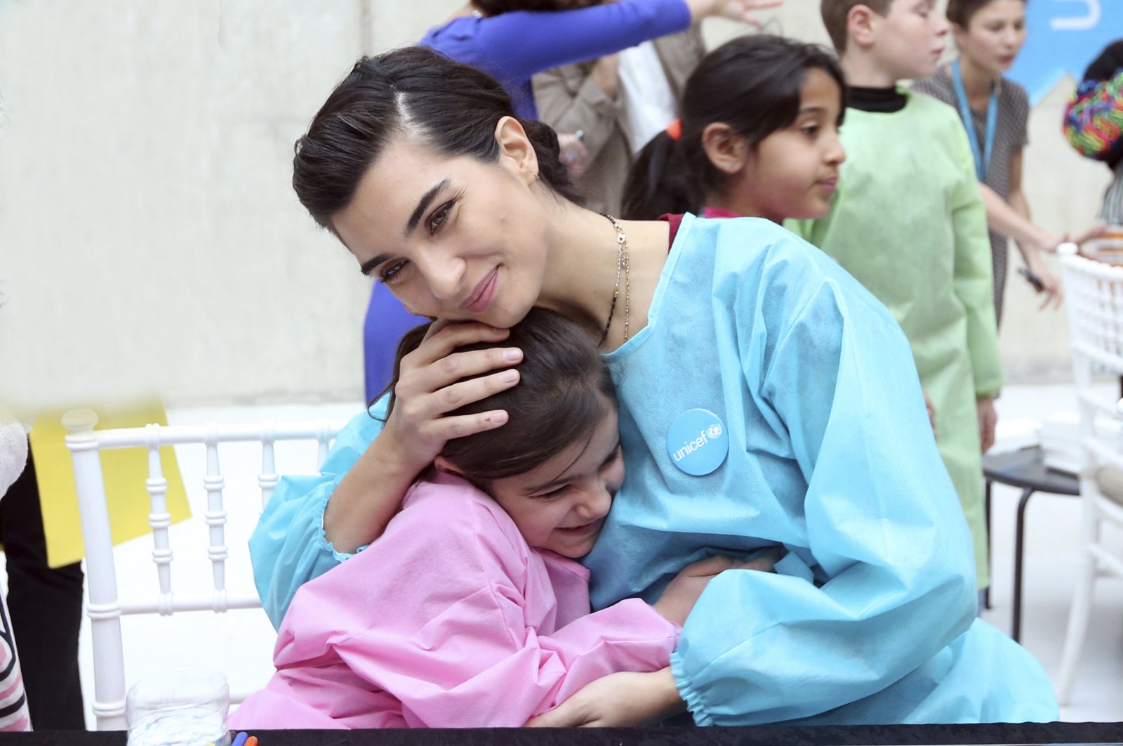 Famous Turkish actress Tuba Büyüküstün, who is also a UNICEF goodwill ambassador, in an organization for refugee children, in Turkey, 2018. (AA Photo) 