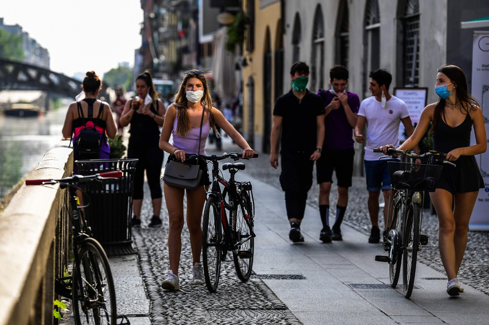 People stroll along the Navigli canals in Milan, Italy, May 8, 2020. (AFP Photo) 