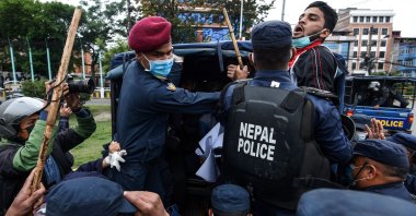 Police detain demonstrators during a protest against India's newly inaugurated link road to the Chinese border, Kathmandu, Nepal, May 10, 2020. (Reuters Photo)