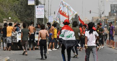 Iraqi protesters gather to block a street during an anti-government demonstration in Iraq's southern city of Nasiriyah, Dhi Qar province, May 10, 2020. (AFP Photo)