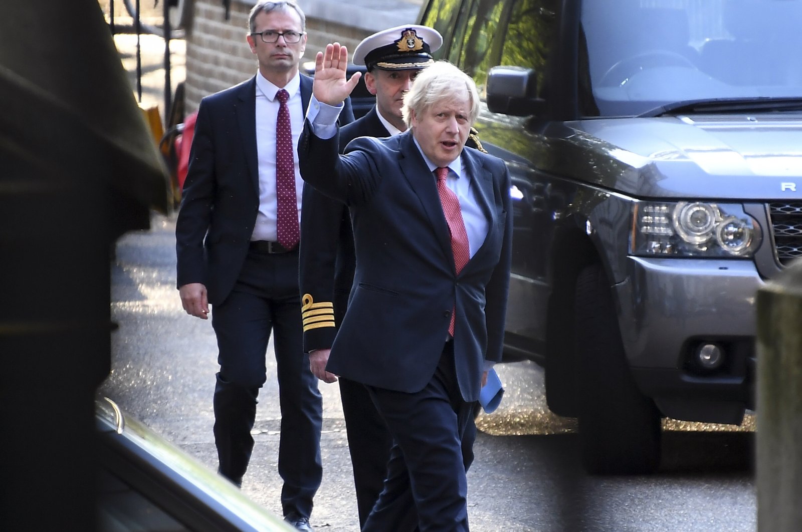 Britain's Prime Minister Boris Johnson walks into the rear entrance of Downing Street, in London, May 7, 2020 (AP Photo)