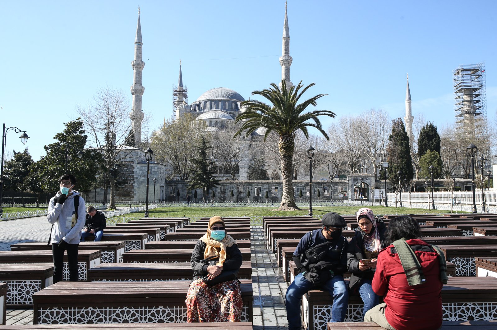 Tourists are seen near Sultanahmet Mosque, also known as the Blue Mosque, during the coronavirus outbreak, Istanbul, Turkey, March 21, 2020. (AA Photo)