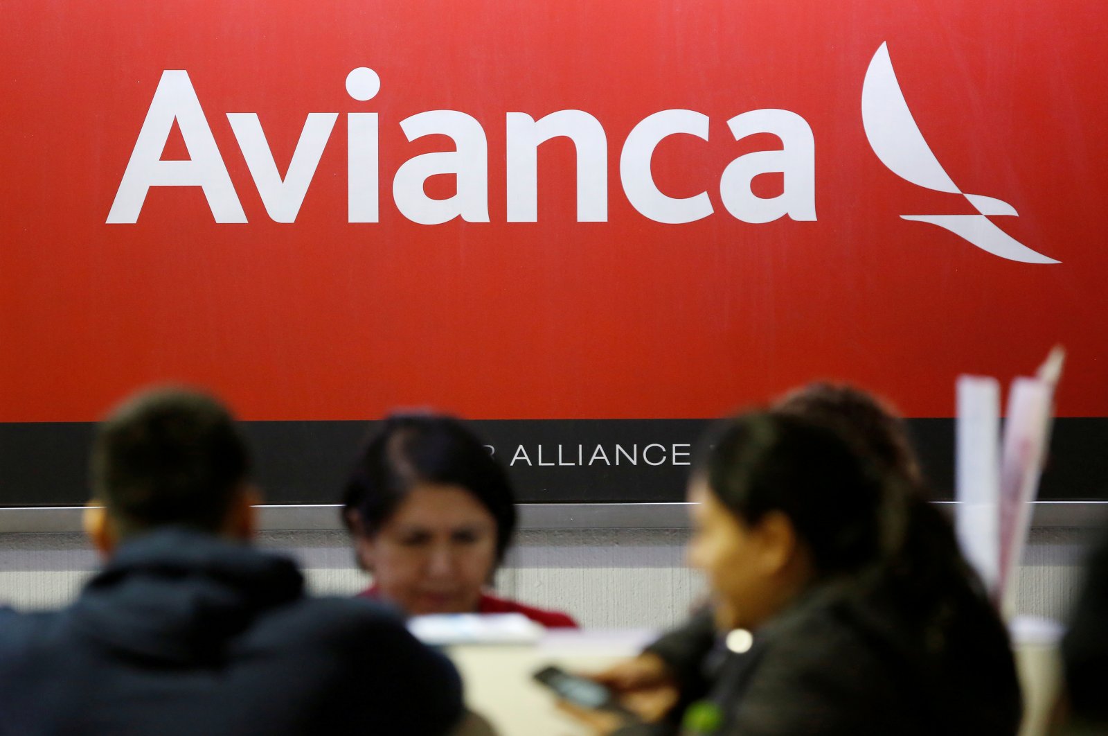 The logo of Avianca Airlines is pictured at a counter following the cancellation of Avianca flight 431, after El Salvador's President Nayib Bukele accused Mexico of allowing a dozen confirmed coronavirus (COVID-19) cases to board the flight due to leave Mexico City for San Salvador, at the Benito Juarez International Airport in Mexico City, Mexico, March 16, 2020.  (Reuters File Photo)