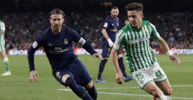 Real Madrid's Sergio Ramos fights for the ball against Betis' Alex Moreno during a La Liga match in Seville, Spain, March. 8, 2020. (AP Photo)