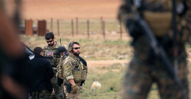 Members of the YPG and U.S. troops are seen during a patrol near the Turkish border in Syria's Hasakah province, Nov.4, 2018. (REUTERS)