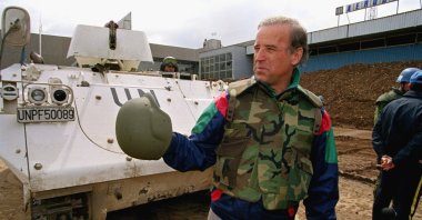 Sen. Joe Biden (D-Del.) stands in front of a Danish armored personnel carrier at the U.N.-controlled Sarajevo Airport, April 9, 1993, making a statement about his trip to the besieged Bosnian capital. (AP Photo)