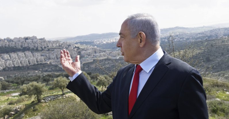 Israeli Prime Minister Benjamin Netanyahu visits the area where a new neighborhood is to be built in the East Jerusalem settlement of Har Homa, Israel, Feb. 20, 2020. (AP Photo)