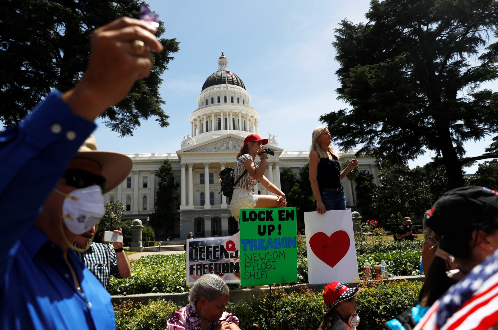 Demonstrators rally during a protest calling for the reopening of California amid the coronavirus outbreak outside the California State Capitol building in Sacramento, California, U.S., May 7, 2020. (Reuters Photo)