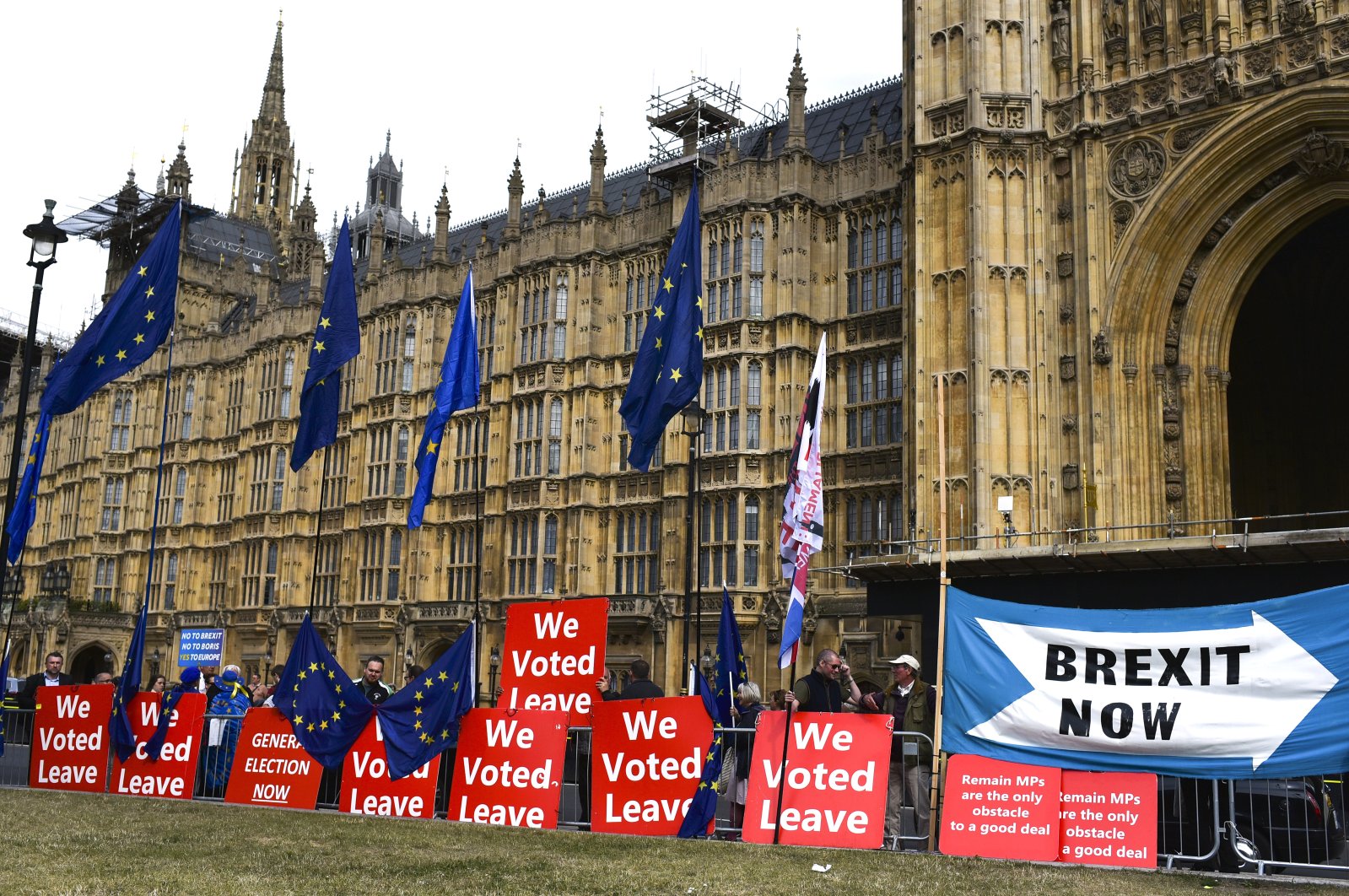 Pro Brexit placards and EU flags are pictured outside the Houses of Parliament, London, Sept. 5, 2019. (AP Photo)