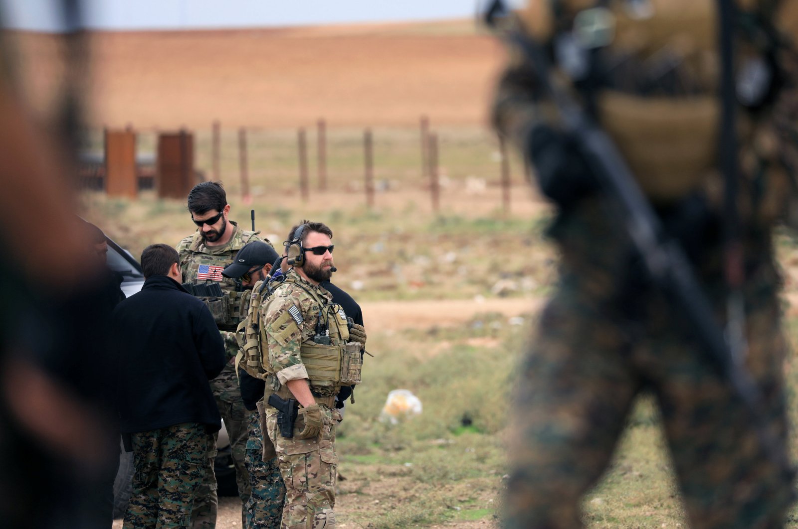 Members of the YPG and U.S. troops are seen during a patrol near the Turkish border in Syria's Hasakah province, Nov.4, 2018. (REUTERS)