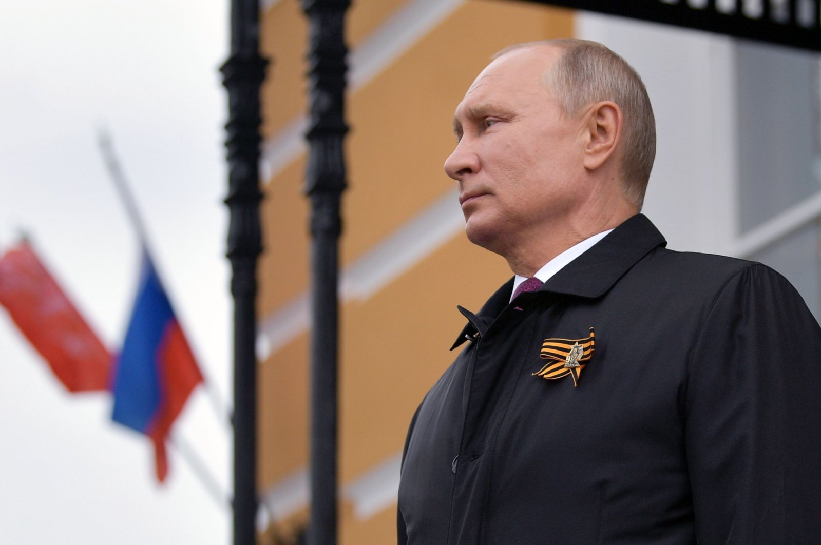 Russian President Vladimir Putin looks at military aircrafts flying over the Kremlin and Red Square to mark the 75th anniversary of the victory over Nazi Germany in World War Two, Moscow, May 9, 2020. (AFP Photo)